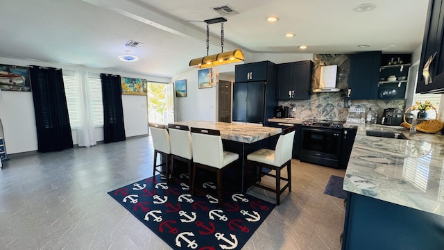 kitchen featuring pendant lighting, sink, paneled built in refrigerator, black range with electric cooktop, and wall chimney exhaust hood