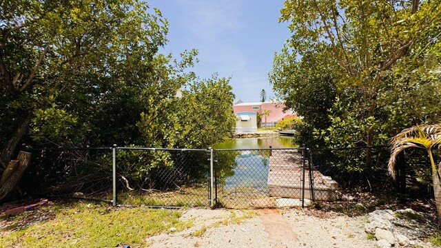 18 W Circle Dr, Saddle Bunch, FL 33040 - view of gate with a water view
