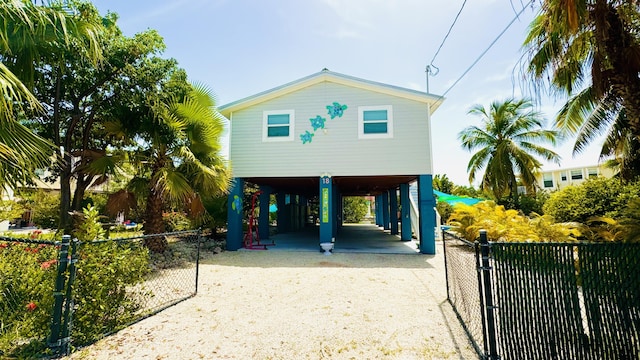 view of front of property featuring a carport