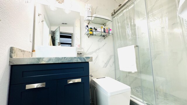 18 W Circle Dr, Saddle Bunch, FL 33040 - bathroom featuring a shower with door, vanity, tile walls, and toilet