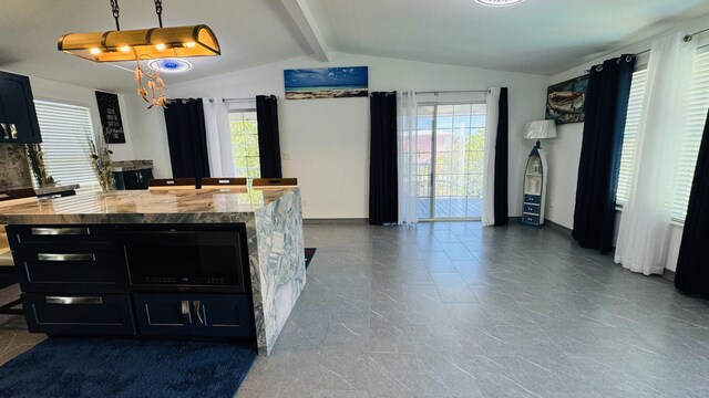 18 W Circle Dr, Saddle Bunch, FL 33040 - kitchen with butcher block counters, hanging light fixtures, and vaulted ceiling with beams