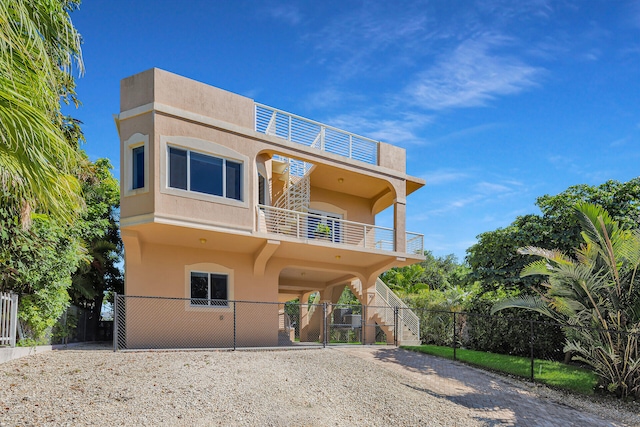 view of front of home featuring a balcony