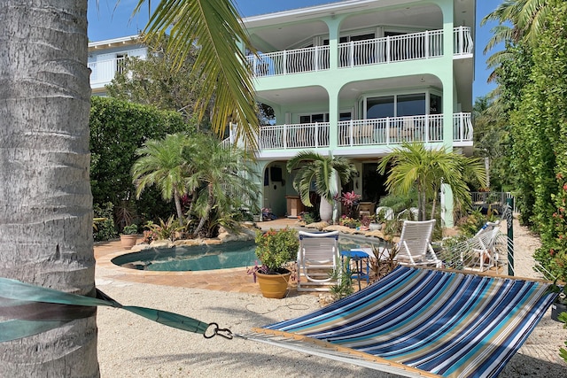 back of property featuring a patio area