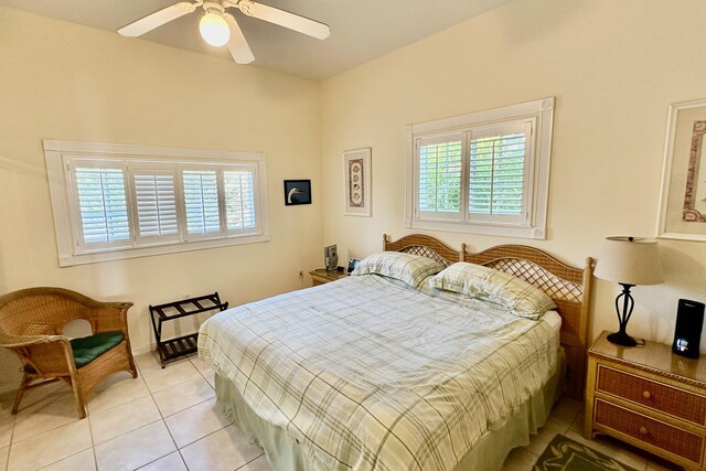 tiled bedroom with ceiling fan