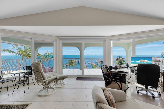 sunroom featuring vaulted ceiling