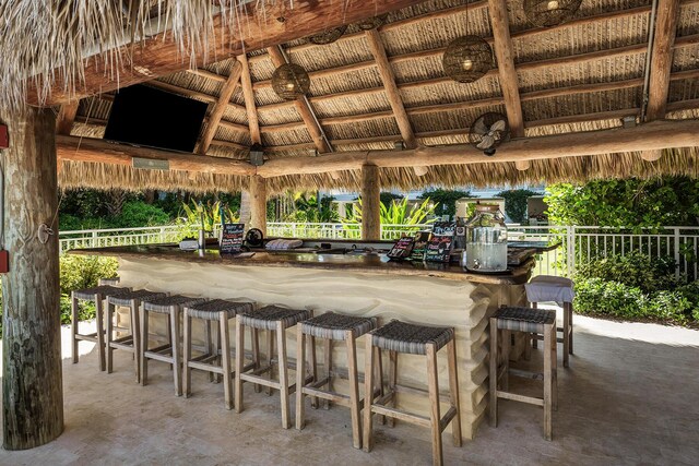 view of patio with a gazebo and exterior bar