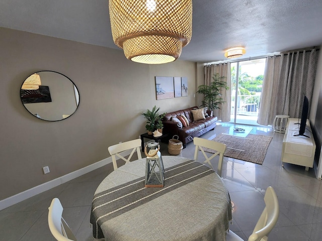 88500 Overseas Hwy Unit 301, Tavernier, FL 33070 - tiled dining space featuring floor to ceiling windows and a textured ceiling