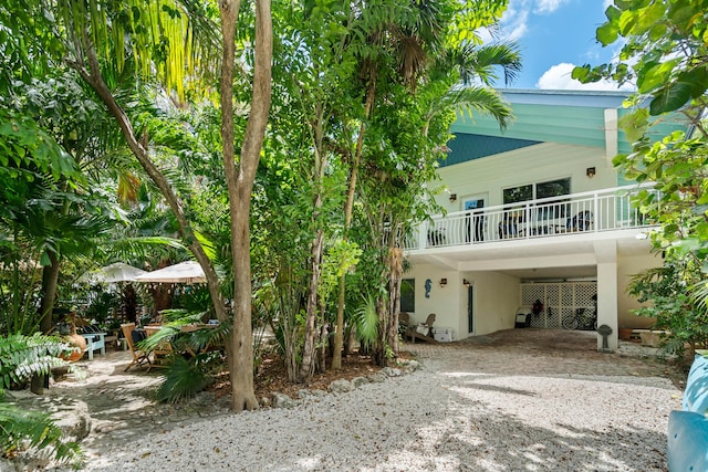 rear view of house with a carport