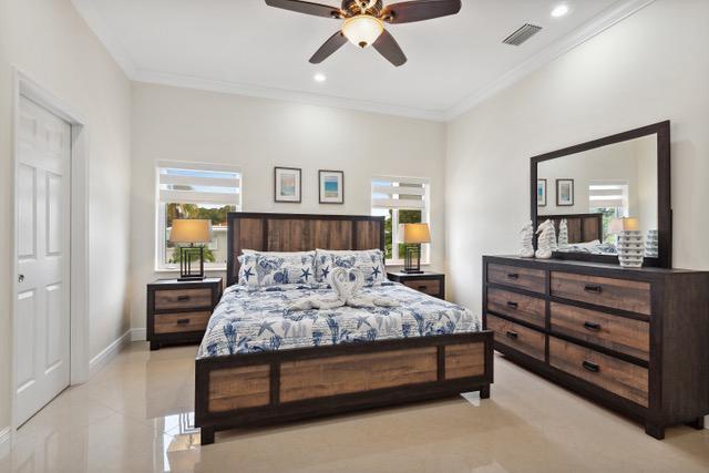 911 Red Bird Rd, Key Largo, FL 33037 - bedroom featuring multiple windows, ornamental molding, recessed lighting, ceiling fan, and light tile patterned floors