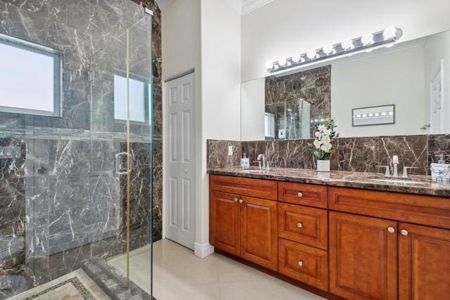 911 Red Bird Rd, Key Largo, FL 33037 - full bath with double vanity, ornamental molding, a marble finish shower, and tile patterned floors