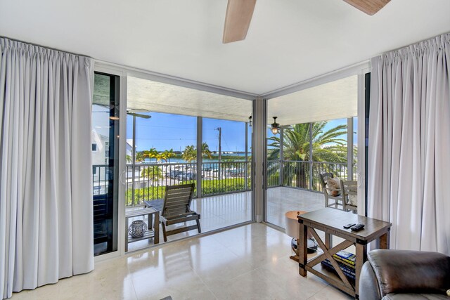 8302 Marina Villas Dr Unit 8302, Duck, FL 33050 - interior space featuring floor to ceiling windows, light tile patterned floors, and ceiling fan