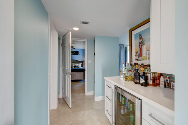 8302 Marina Villas Dr Unit 8302, Duck, FL 33050 - bar with white cabinets and wine cooler