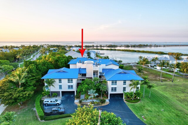 8302 Marina Villas Dr Unit 8302, Duck, FL 33050 - aerial view at dusk with a water view