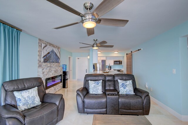 8302 Marina Villas Dr Unit 8302, Duck, FL 33050 - living room featuring a barn door, a stone fireplace, and ceiling fan
