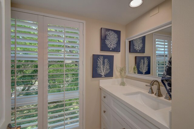 8302 Marina Villas Dr Unit 8302, Duck, FL 33050 - bathroom with vanity and a healthy amount of sunlight