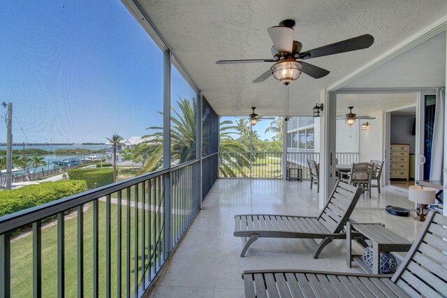 8302 Marina Villas Dr Unit 8302, Duck, FL 33050 - balcony with ceiling fan and a water view
