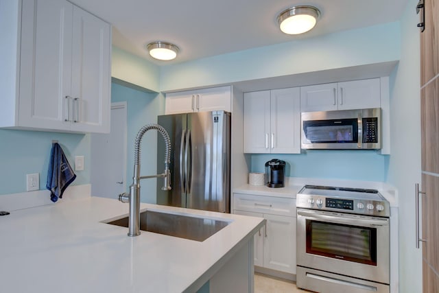 8302 Marina Villas Dr Unit 8302, Duck, FL 33050 - kitchen with white cabinetry, appliances with stainless steel finishes, and sink