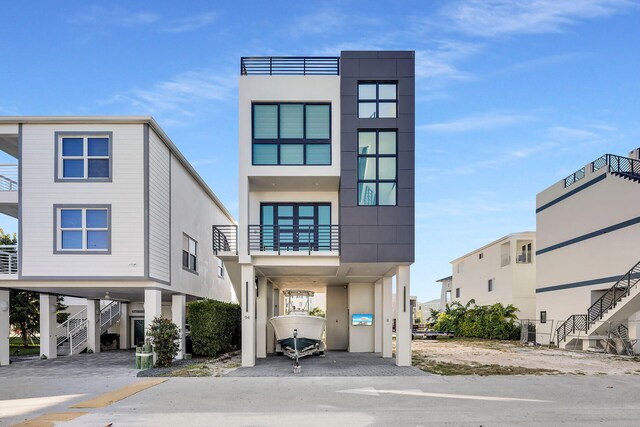 view of front of property featuring a carport