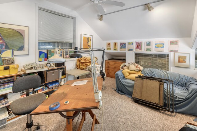 office space featuring rail lighting, lofted ceiling, carpet floors, and ceiling fan