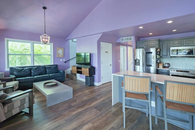 112 Gardenia St, Tavernier, FL 33070 - living room featuring lofted ceiling, dark wood-style floors, recessed lighting, a chandelier, and baseboards