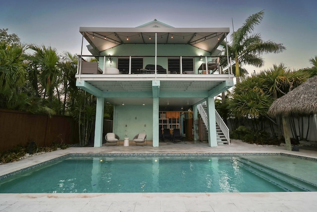 112 Gardenia St, Tavernier, FL 33070 - back of house with stairs, a balcony, and a patio area