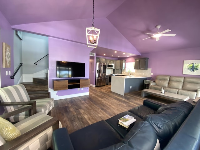 112 Gardenia St, Tavernier, FL 33070 - living room with dark wood-type flooring, stairway, high vaulted ceiling, and a ceiling fan