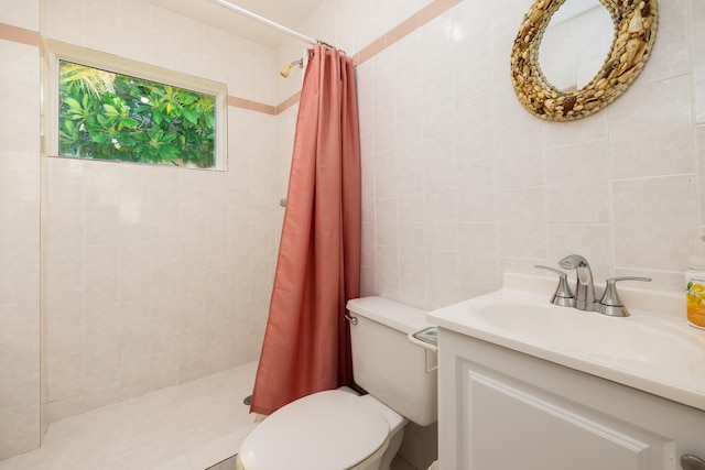 bathroom featuring vanity, curtained shower, tile walls, and toilet