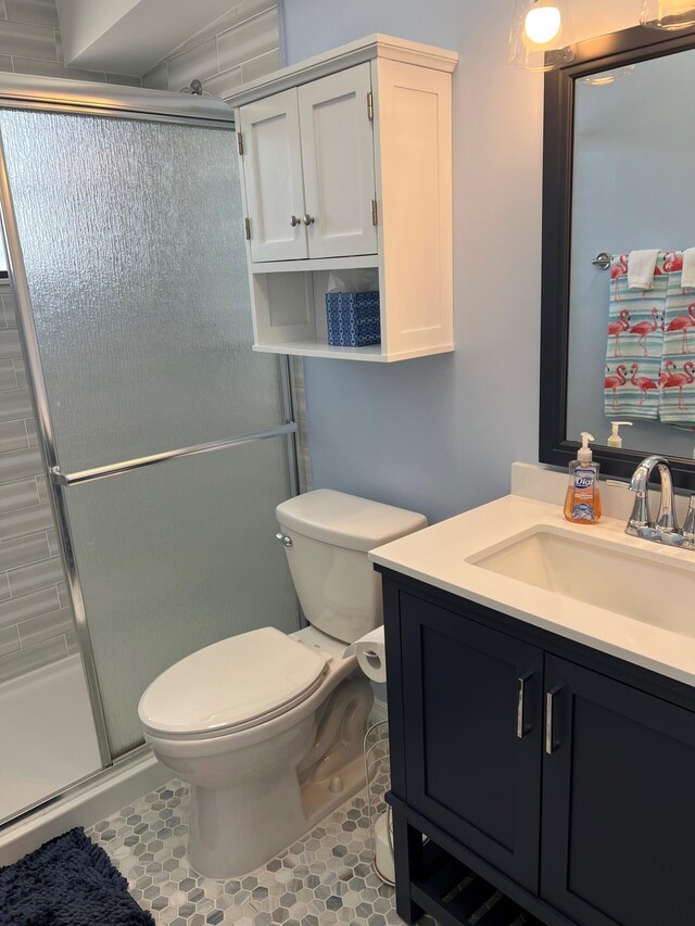 16 Shoreland Dr, Key Largo, FL 33037 - full bath with tile patterned floors, toilet, vanity, and a shower stall
