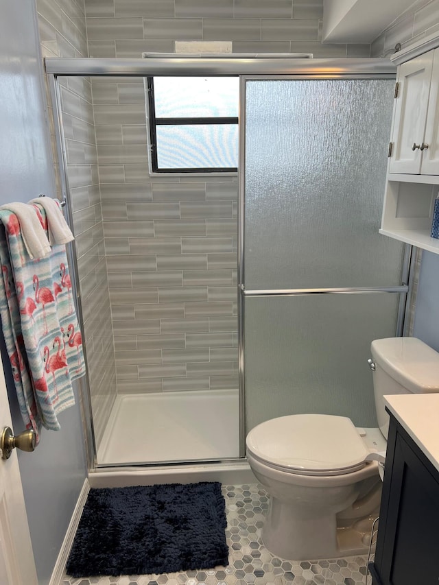 16 Shoreland Dr, Key Largo, FL 33037 - bathroom with a shower stall, toilet, tile patterned flooring, and vanity