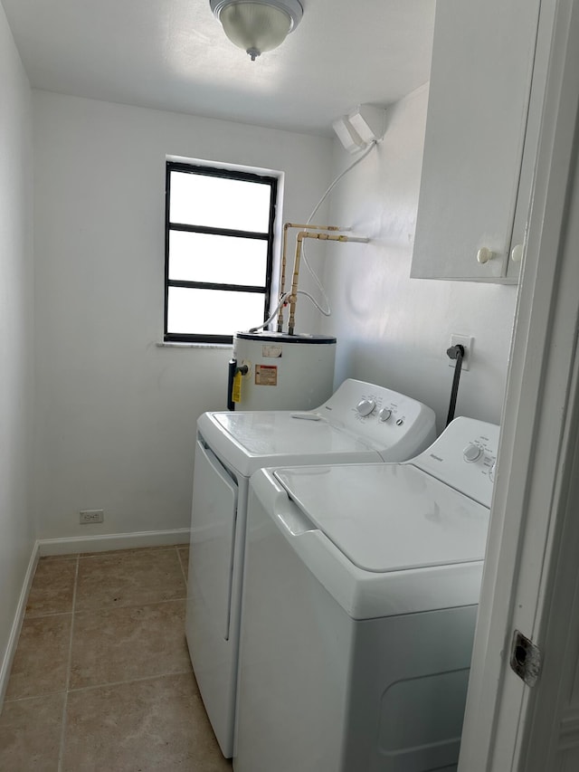 16 Shoreland Dr, Key Largo, FL 33037 - laundry area featuring water heater, cabinet space, washing machine and clothes dryer, and baseboards