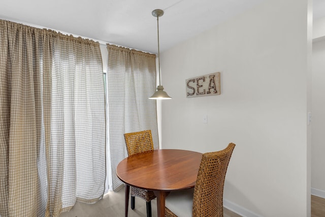 87200 Overseas Hwy Unit O9, Islamorada, FL 33036 - dining room with wood finished floors and baseboards
