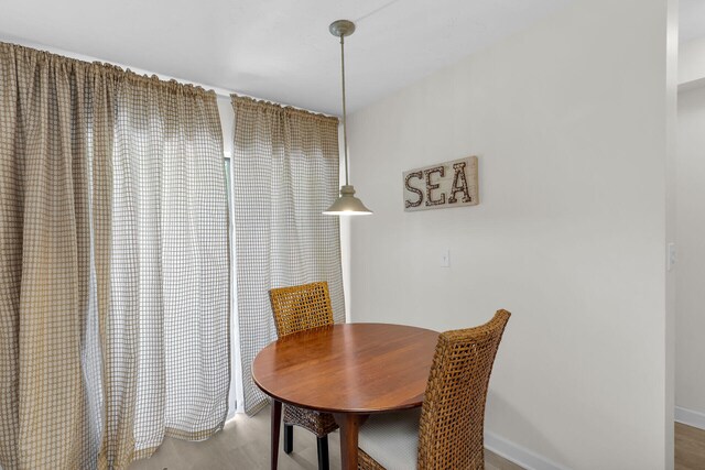 87200 Overseas Hwy Unit O9, Islamorada, FL 33036 - dining room with wood finished floors and baseboards