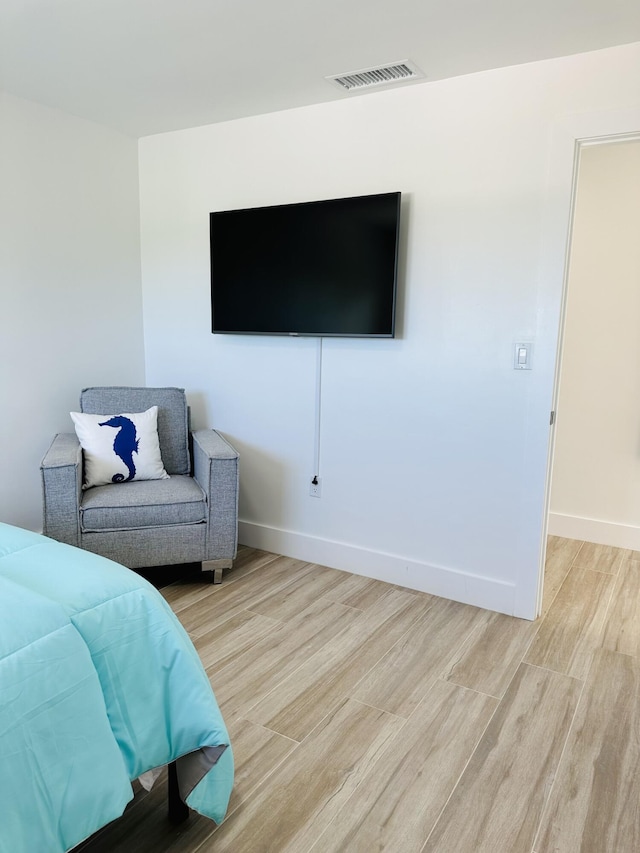 bedroom with light hardwood / wood-style floors