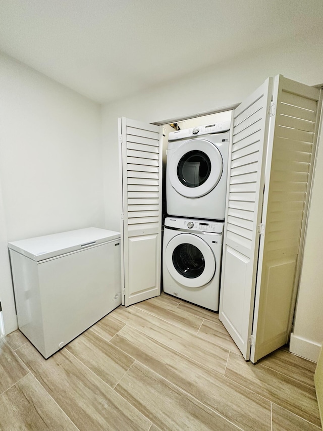 laundry area with stacked washer and clothes dryer