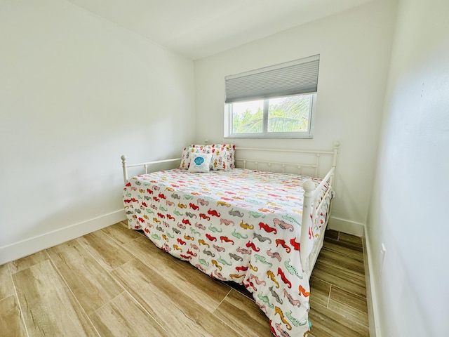 bedroom featuring hardwood / wood-style floors