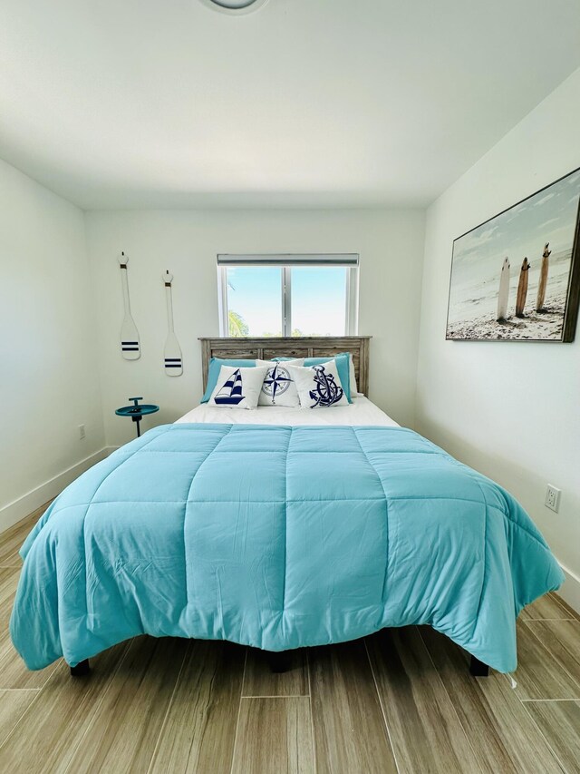 bedroom with light hardwood / wood-style flooring