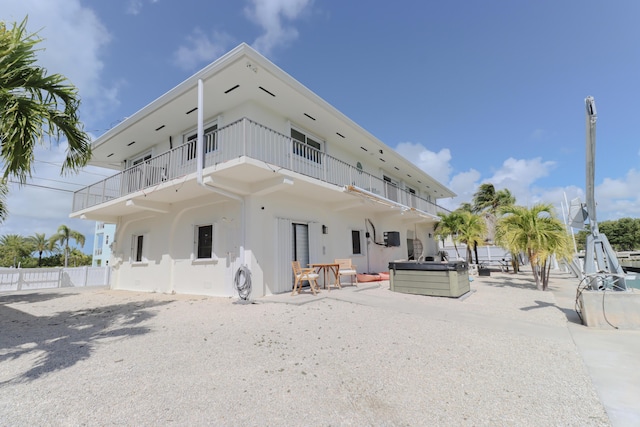 1323 Hudgins Dr, Summerland, FL 33042 - back of property with stucco siding, fence, a patio, and a balcony