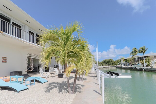 1323 Hudgins Dr, Summerland, FL 33042 - view of pool with a boat dock and a water view