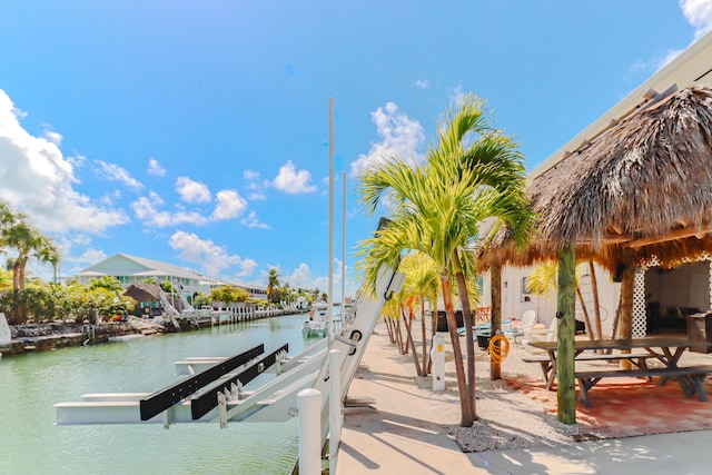 1323 Hudgins Dr, Summerland, FL 33042 - view of dock featuring boat lift and a water view