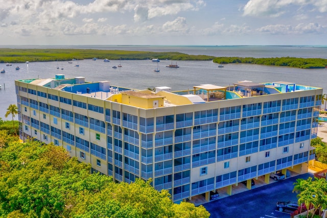 birds eye view of property with a water view