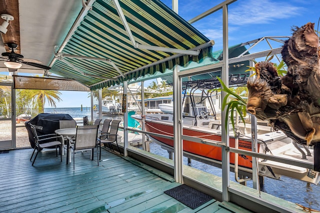 dock area with a water view and boat lift