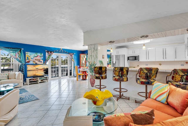living area featuring light tile patterned flooring
