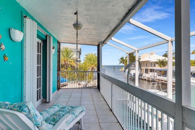 balcony featuring a water view