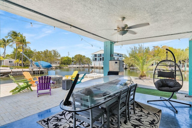 26 Corrine Pl, Key Largo, FL 33037 - view of patio / terrace with a ceiling fan, an outdoor fire pit, a water view, and outdoor dining area