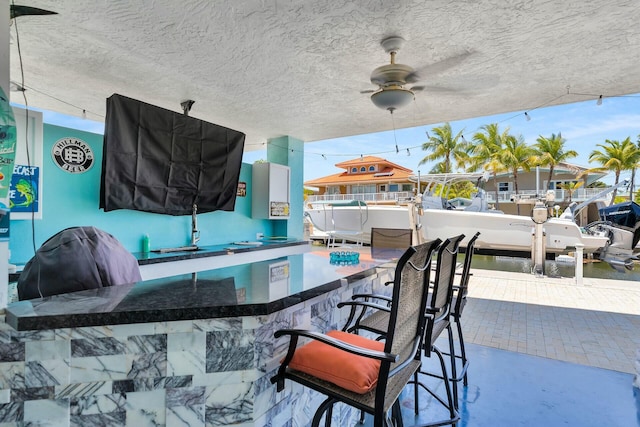 26 Corrine Pl, Key Largo, FL 33037 - view of patio featuring a dock, a ceiling fan, and outdoor wet bar