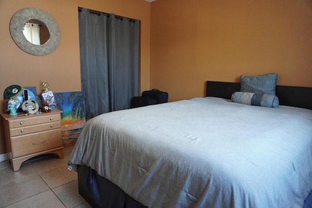 bedroom featuring light tile patterned floors