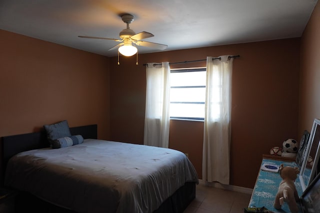 tiled bedroom with ceiling fan