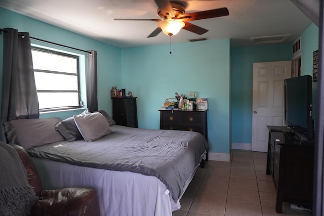 bedroom featuring light tile patterned floors and ceiling fan