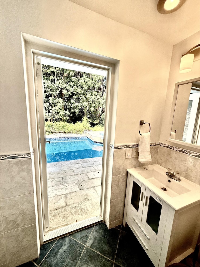 interior space with sink and tile walls