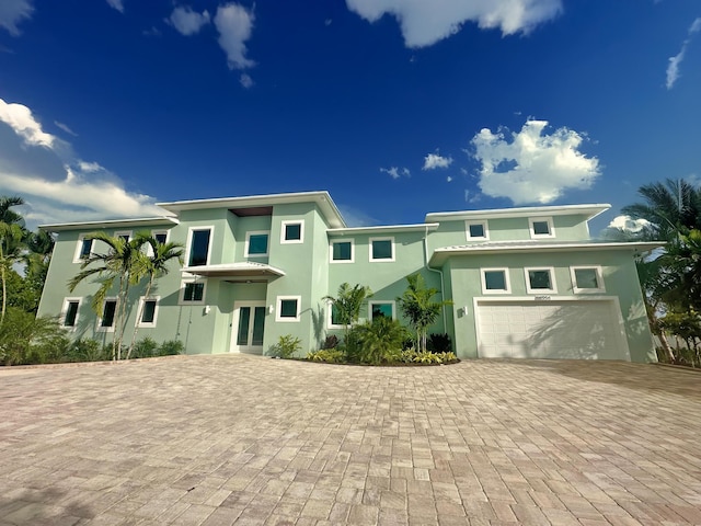 rear view of house with a garage